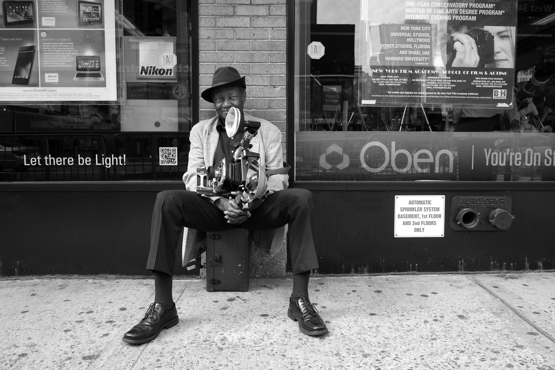 photo 1 - Louis Mendes and his jumbo Speed Graphic camera have been  fixtures on #NYC #streets for more than 60 years. Always looking dapper…